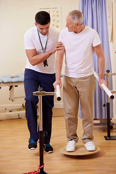 Physical therapist working with client